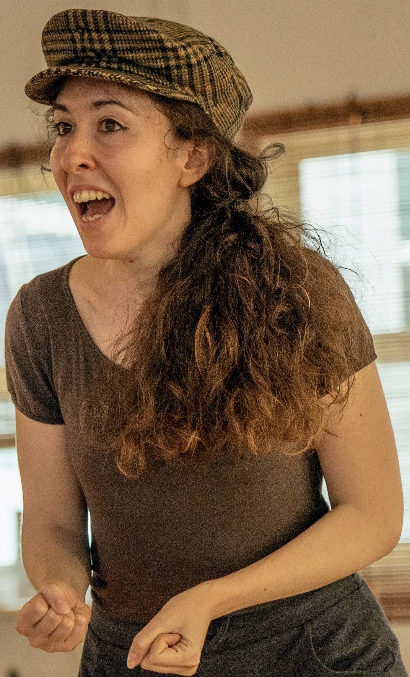 Giorgia mid sentence wearing a hat