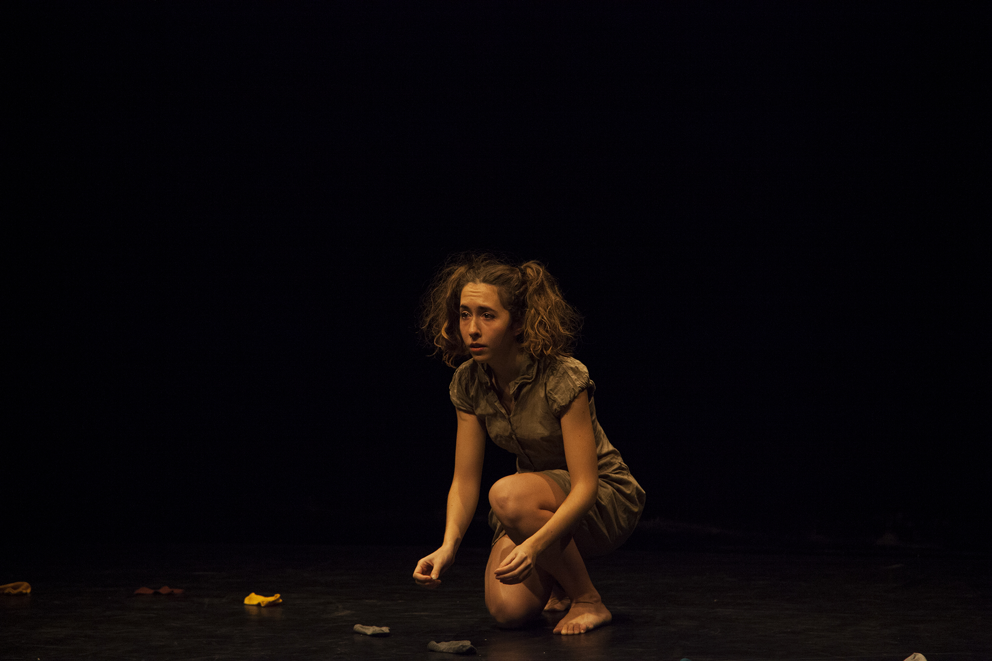 Giorgia crouched on stage looking concerned