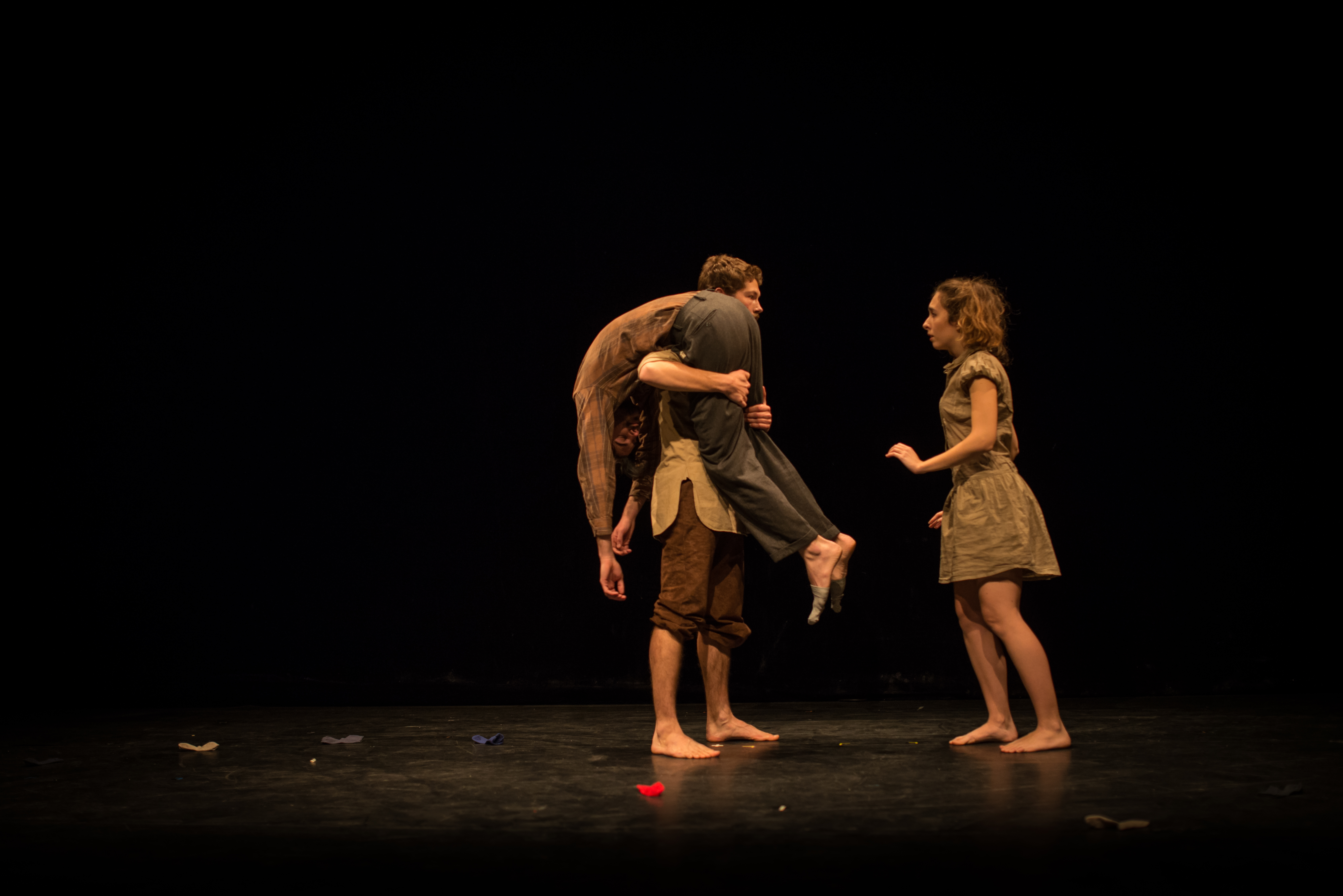 Giorgia watching performer fireman carrying other performer