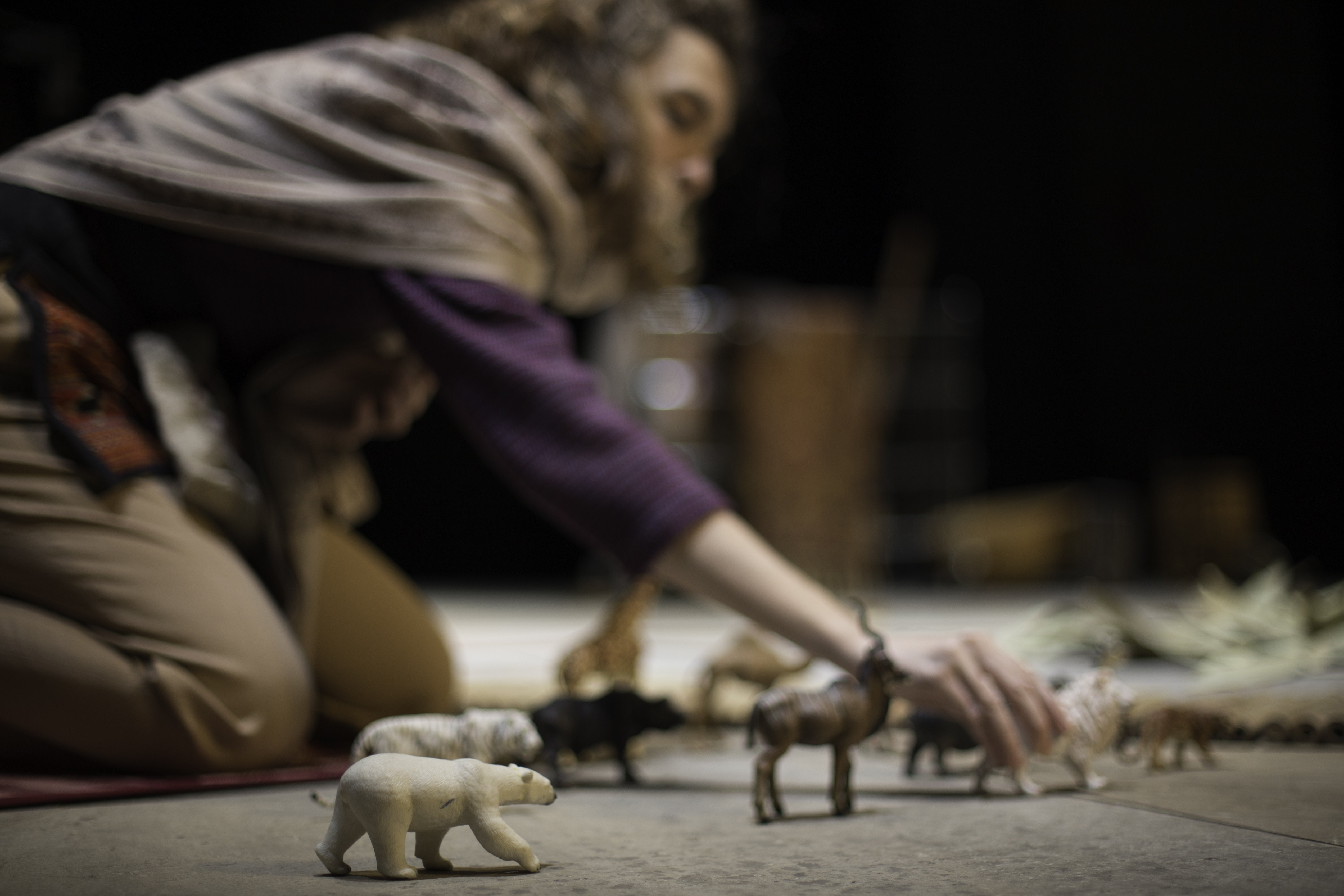Giorgia interacting with toy animals on floor
