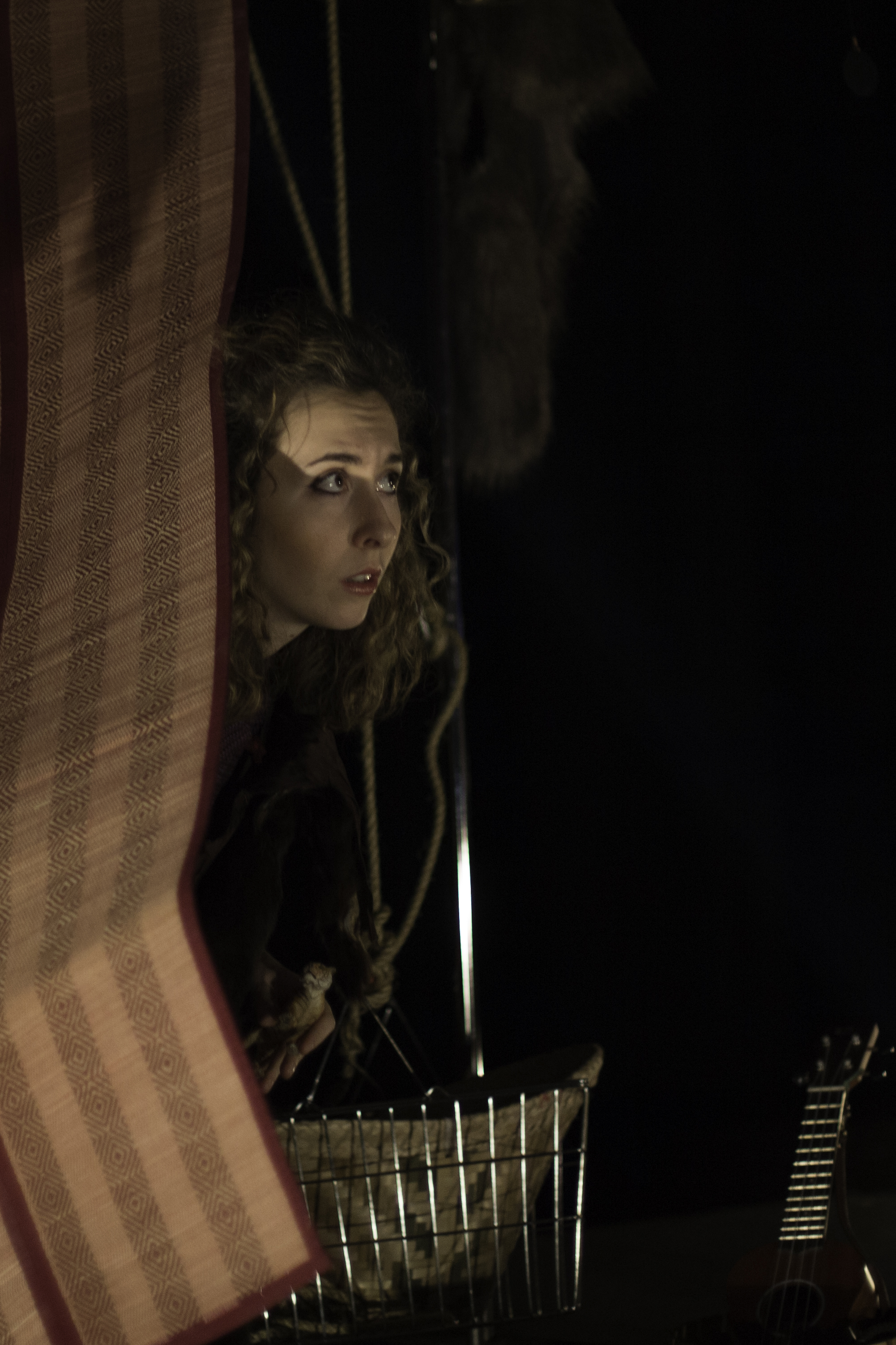 Giorgia peering past curtain, concerned