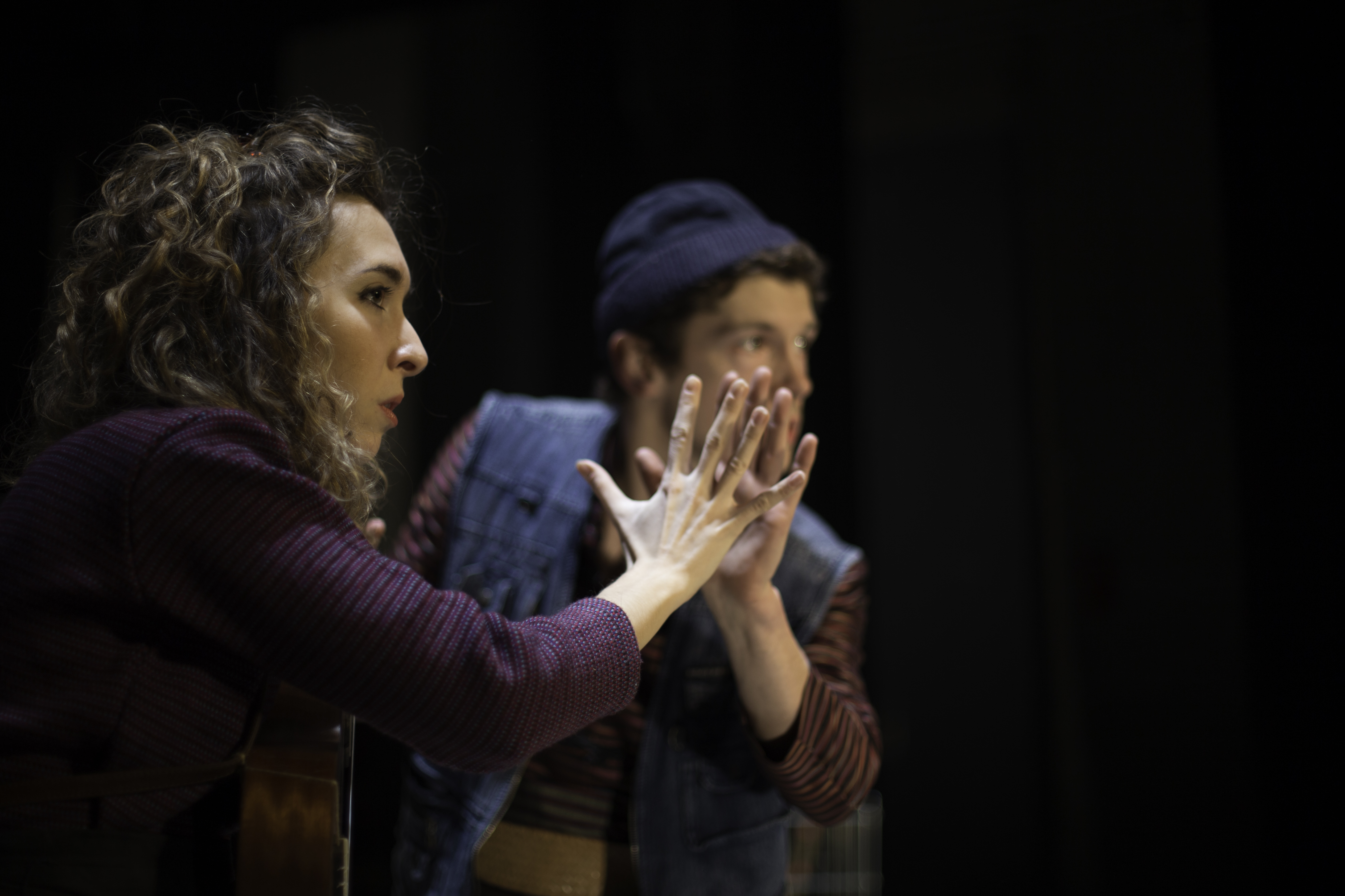 Giorgia mirroring other performer, holding hand to hand