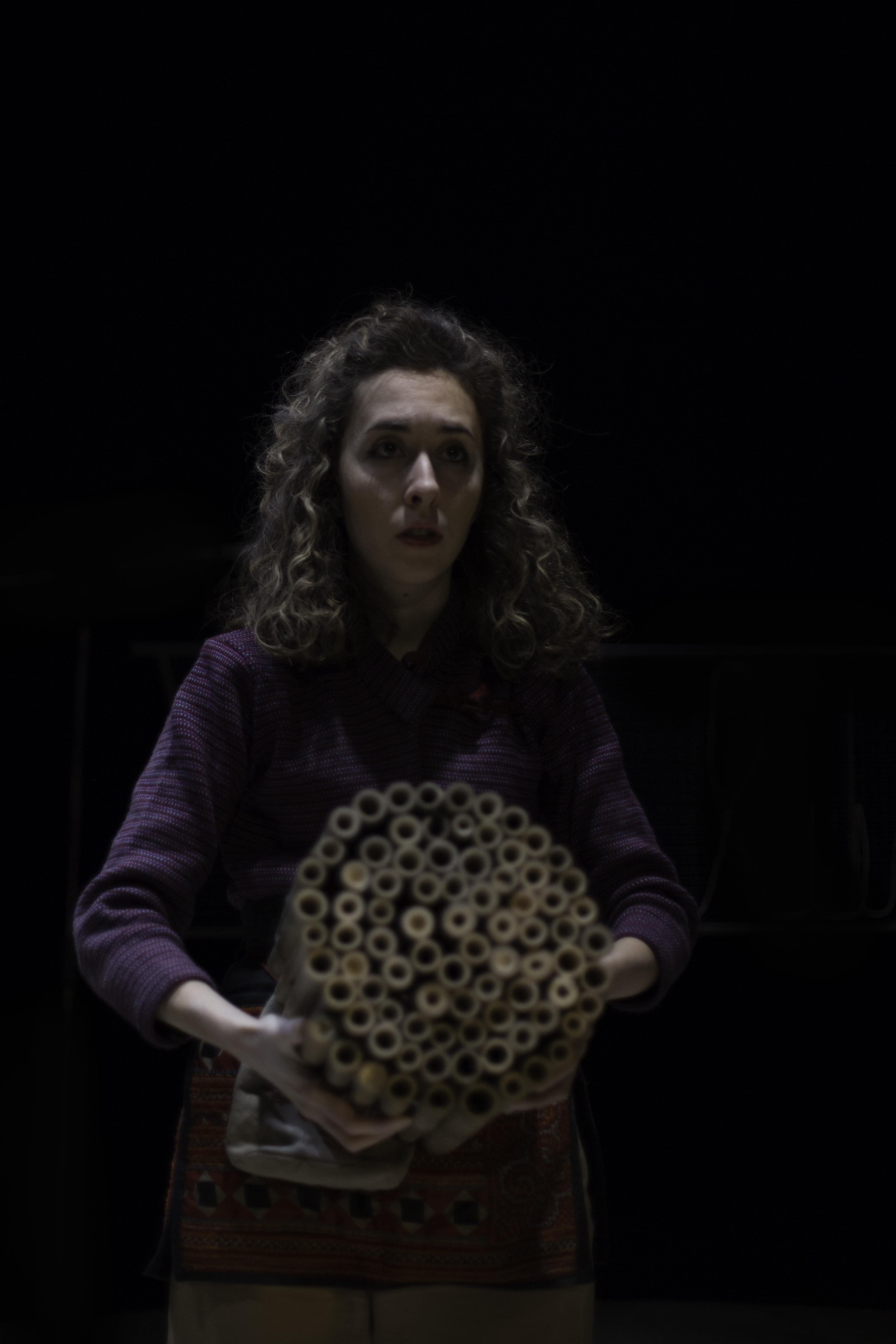 Giorgia holding grouped circle of shortened bamboo