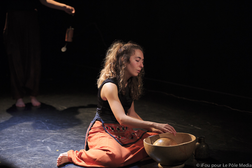 Giorgia sat interacting with wooden bowl