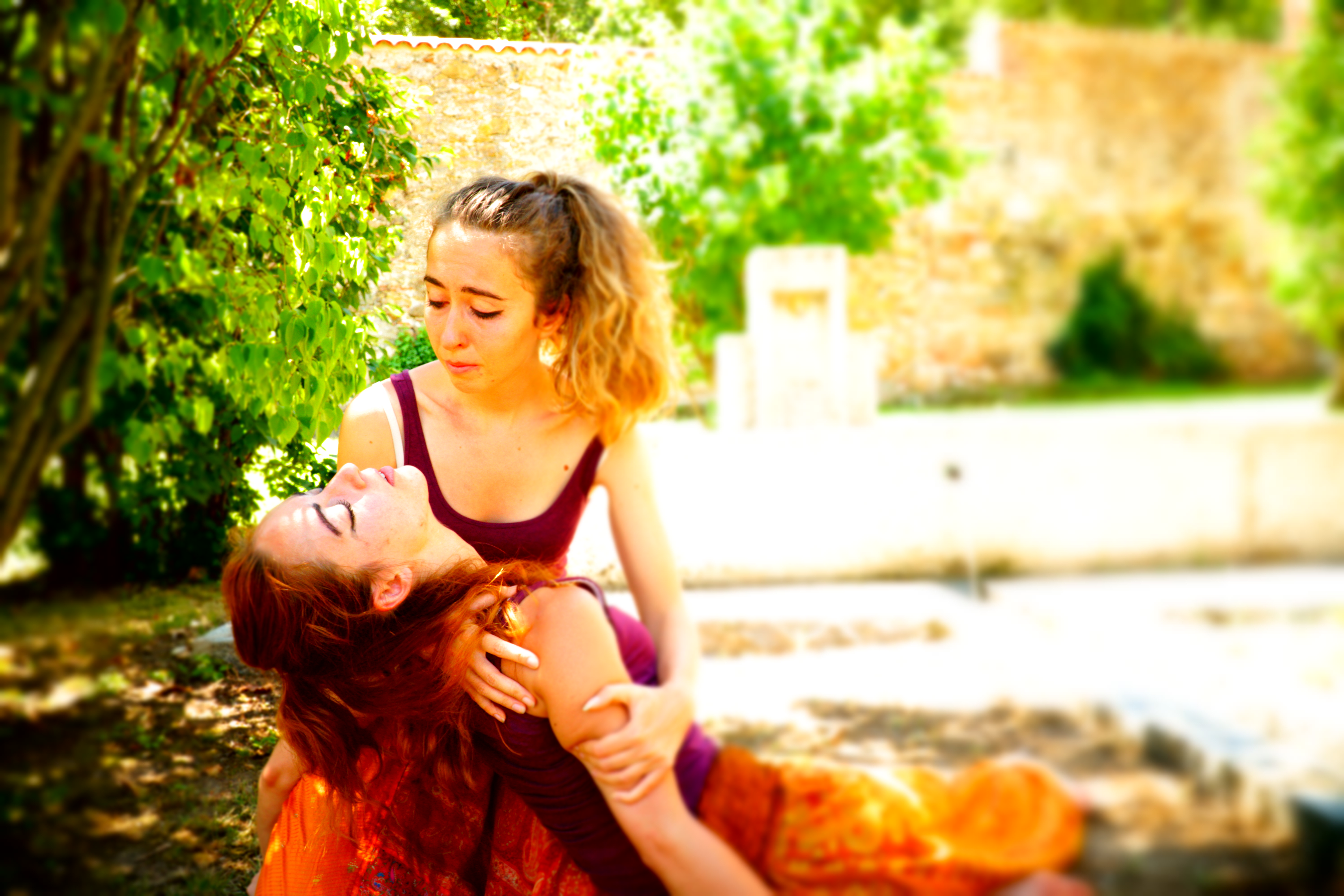 Giorgia, holding unconscious performer, looking upset