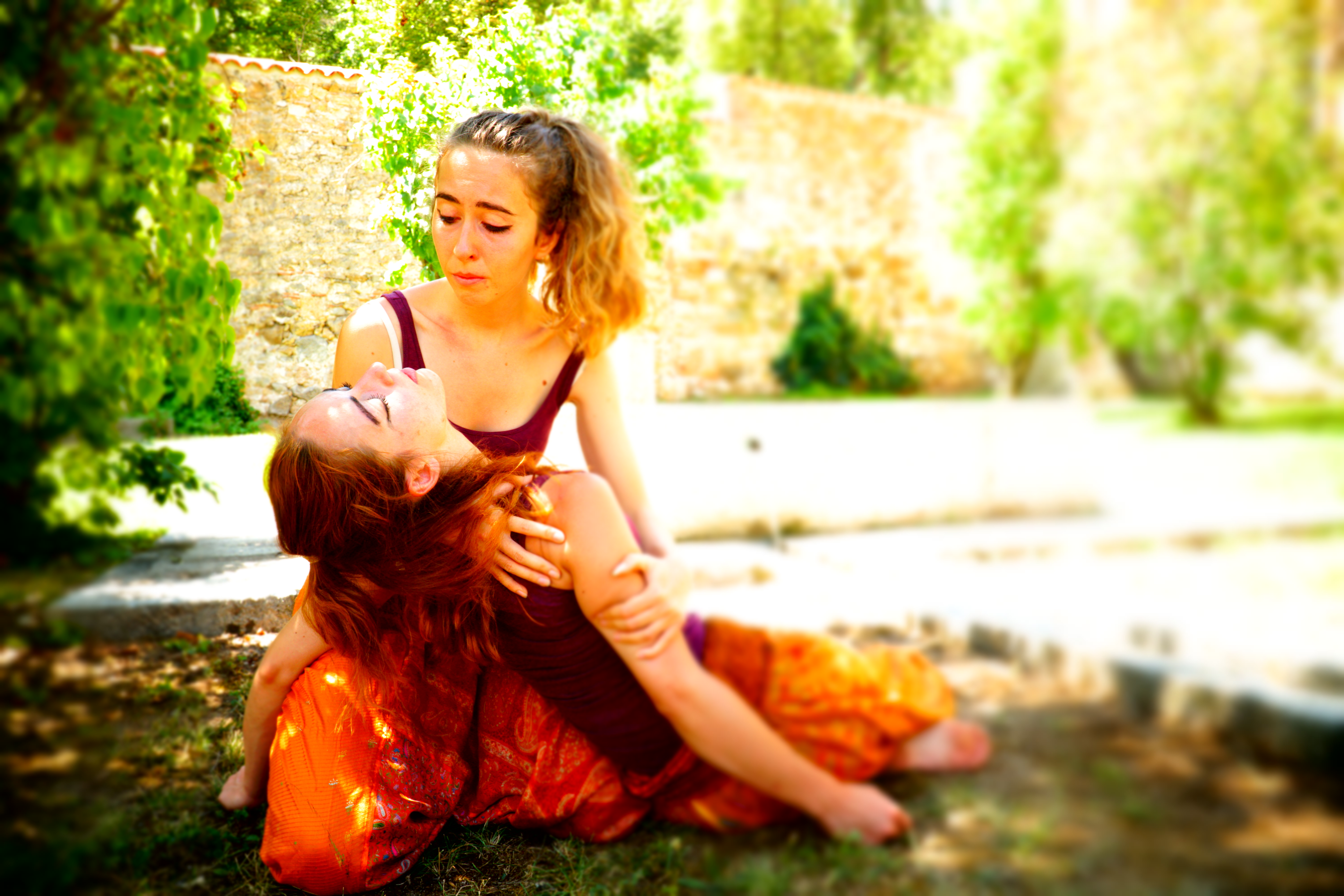 Giorgia, holding unconscious performer, looking upset