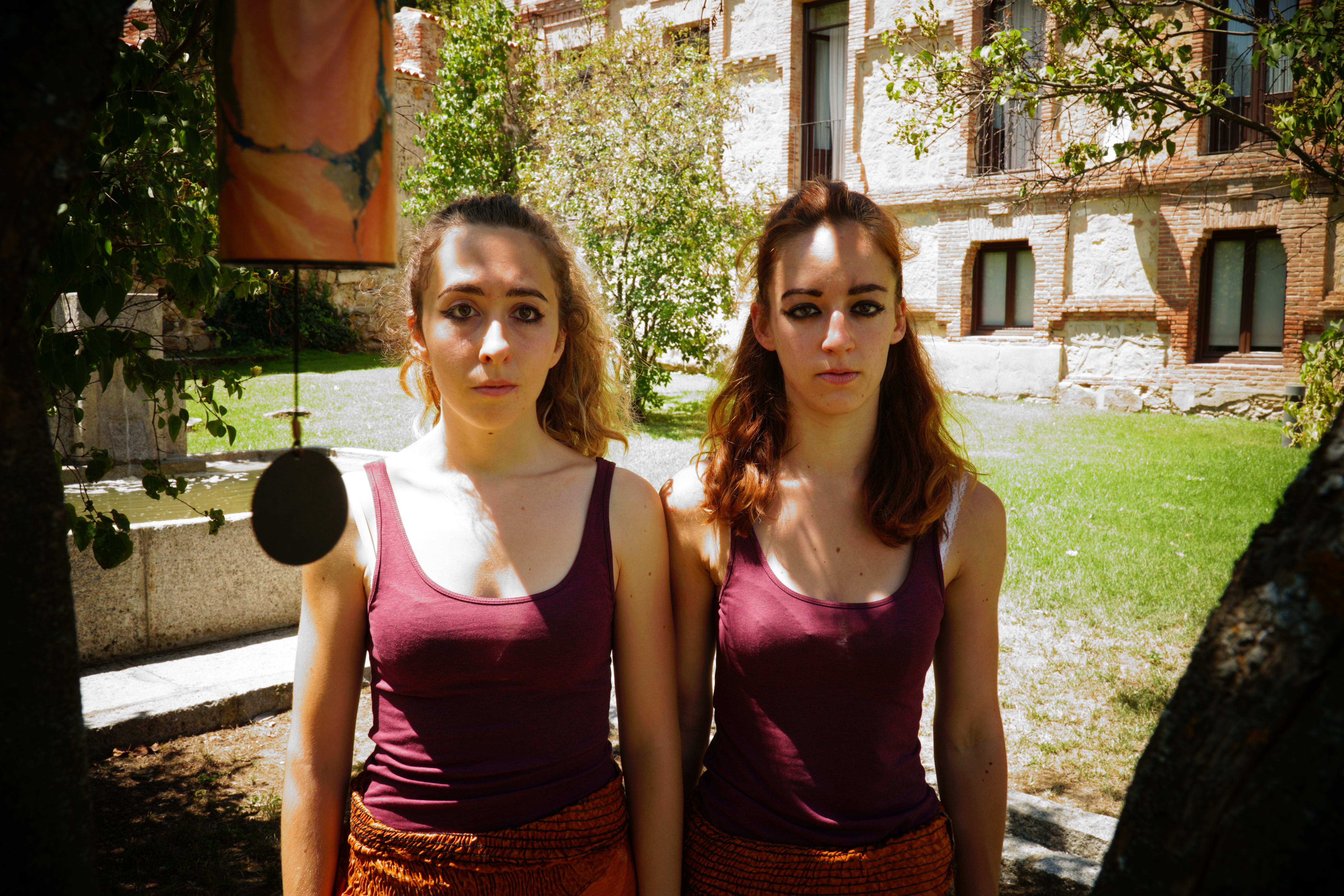 Girogia and performer looking neutrally at the camera