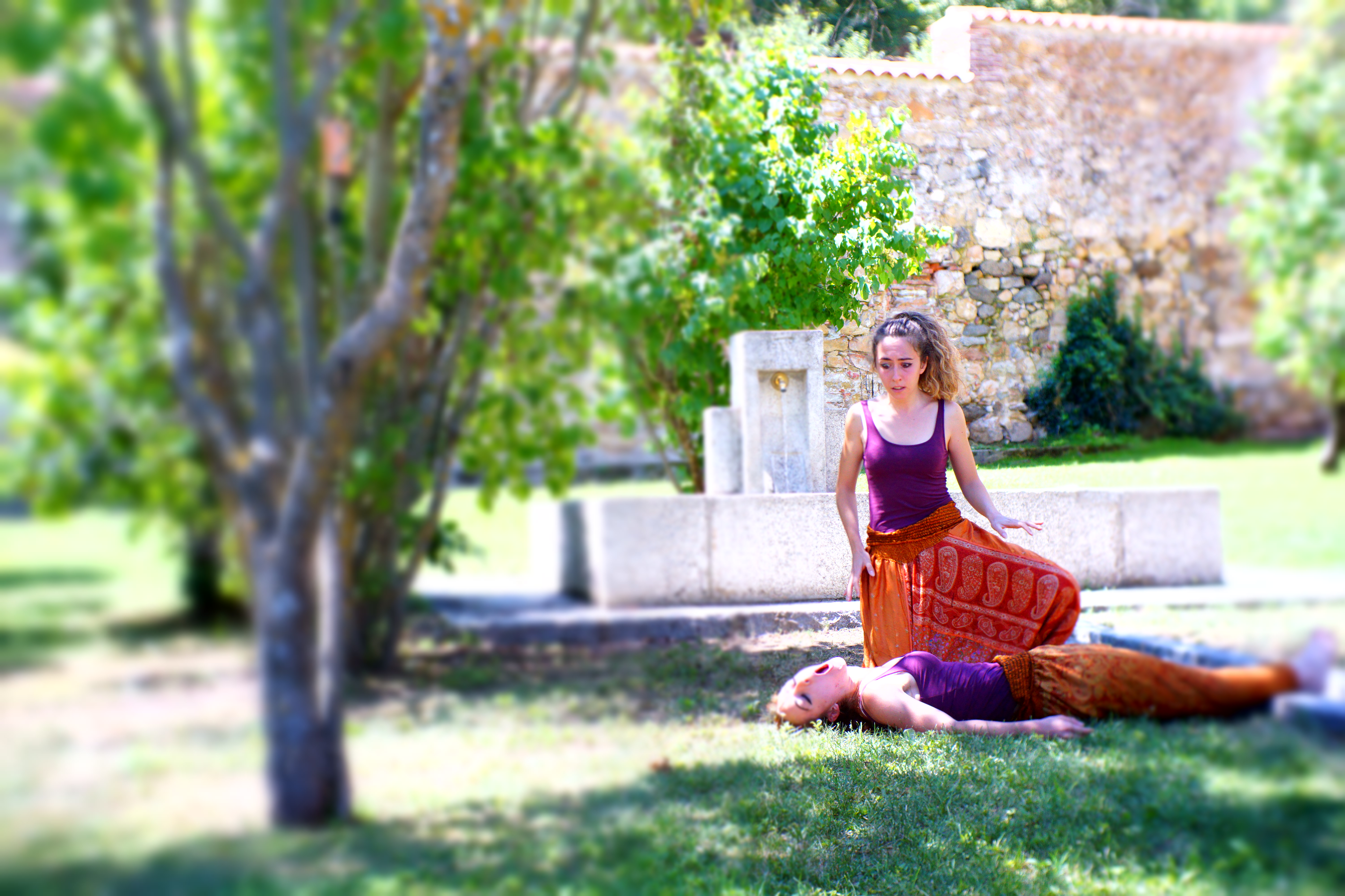 Giorgia looking at unconscious performer, in shock