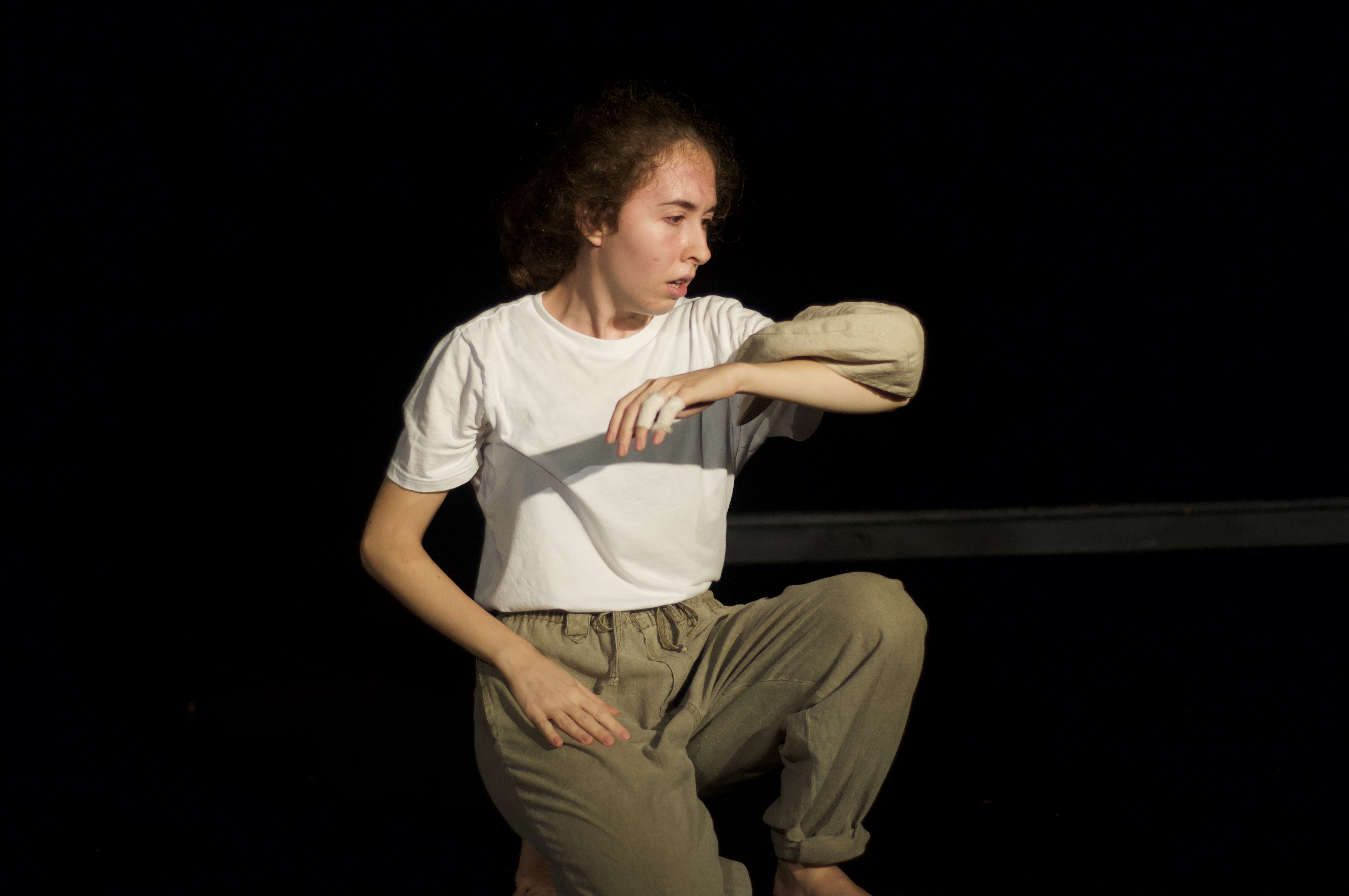 Giorgia balancing hat on arm