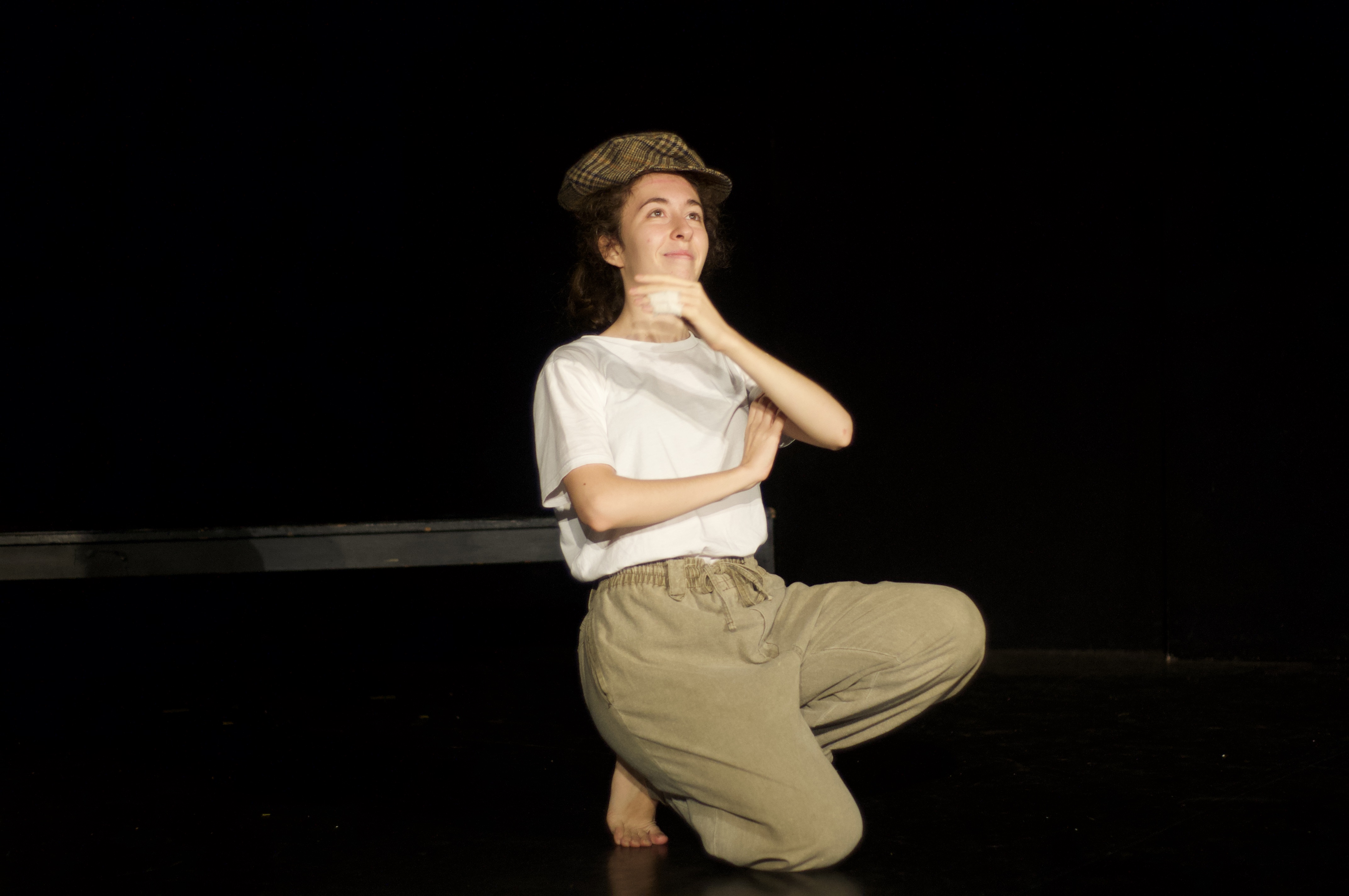 Giorgia looking smug, arms crossed with hand on chin, thinking