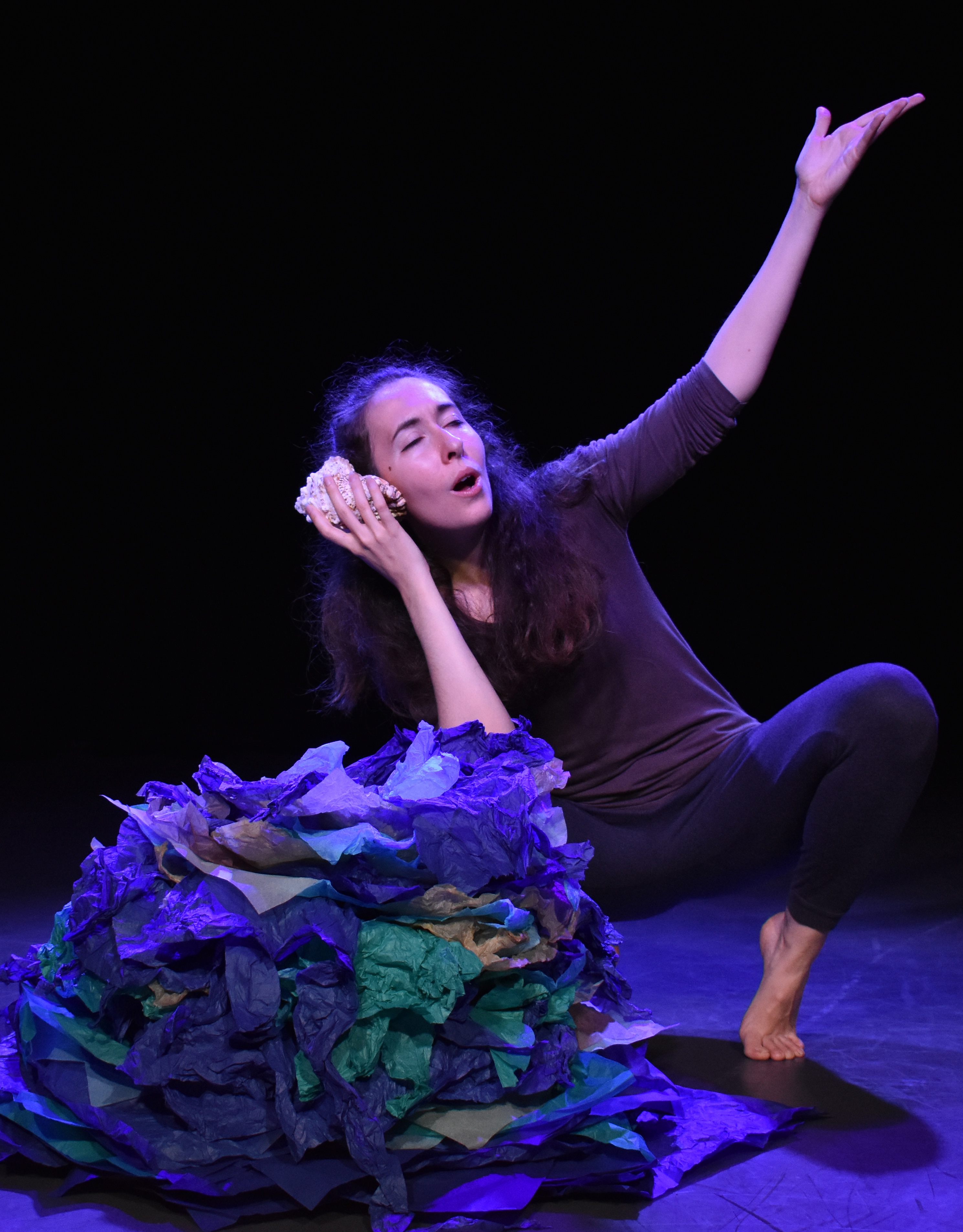 Giorgia on stage, crouched on chair